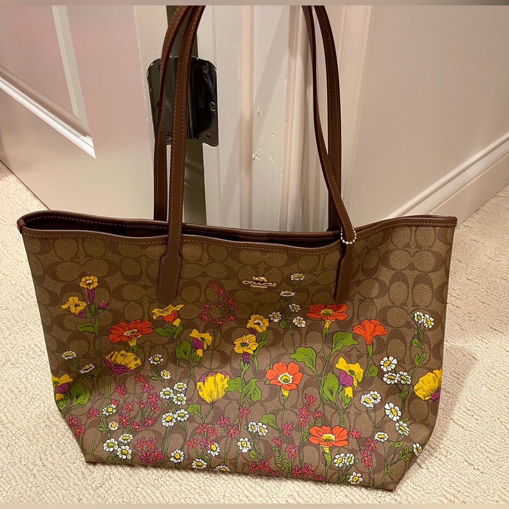 Perfect condition.  Never carried Coach large tote.  Brand new!!
